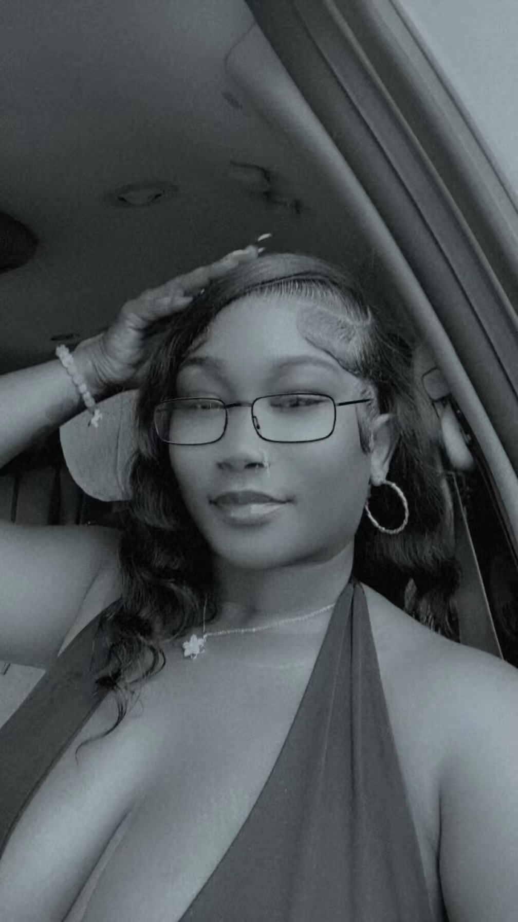 China, founder of China Melts, wearing glasses and gold hoop earrings